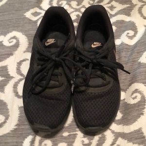 Nike ladies Black Tennis shoe, Rose Gold swoosh.